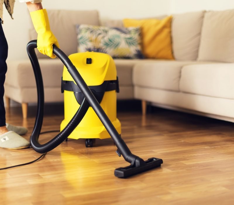 woman-cleaning-sofa-with-yellow-vacuum-cleaner-copy-space-cleaning-service-concept.jpg